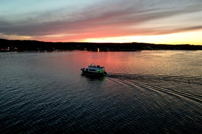 Saulėlydis plaukiant laivu Kuršių mariose