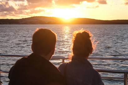 Saulėlydis plaukiant laivu Kuršių mariose